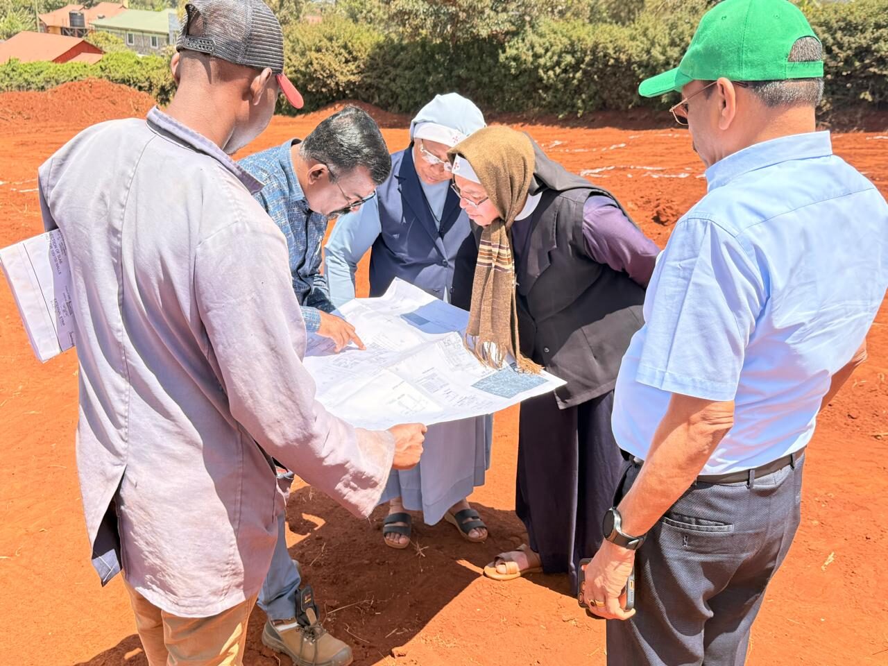 Studying the building plans on site