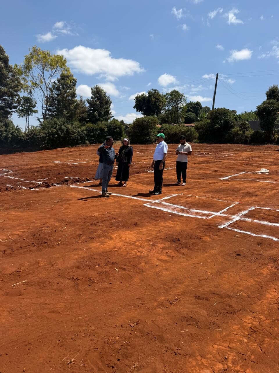 Standing on the marked building footprint